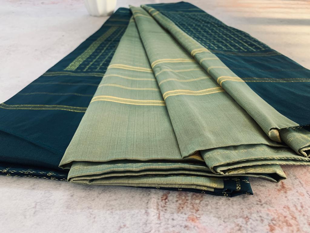 Noil Silk Checked Border sarees bottel green color