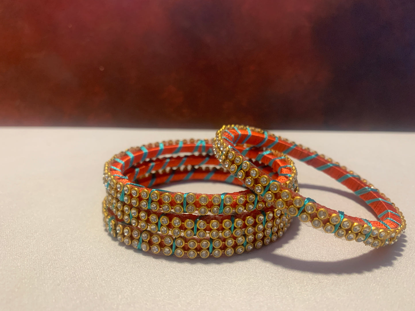 NVSB0011-Orange with white stone silk thread bangle