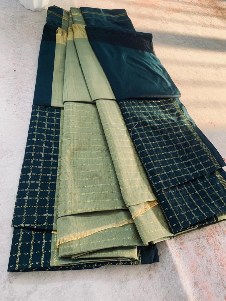 Noil Silk Checked Border sarees bottel green color